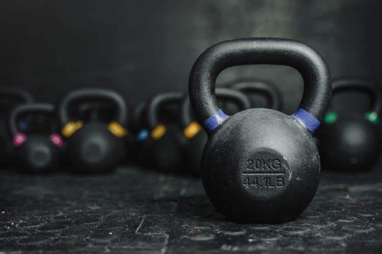 Kettlebells on dark background at a gym