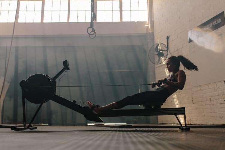 Woman Doing Cardio Workout on a Rowing Machine